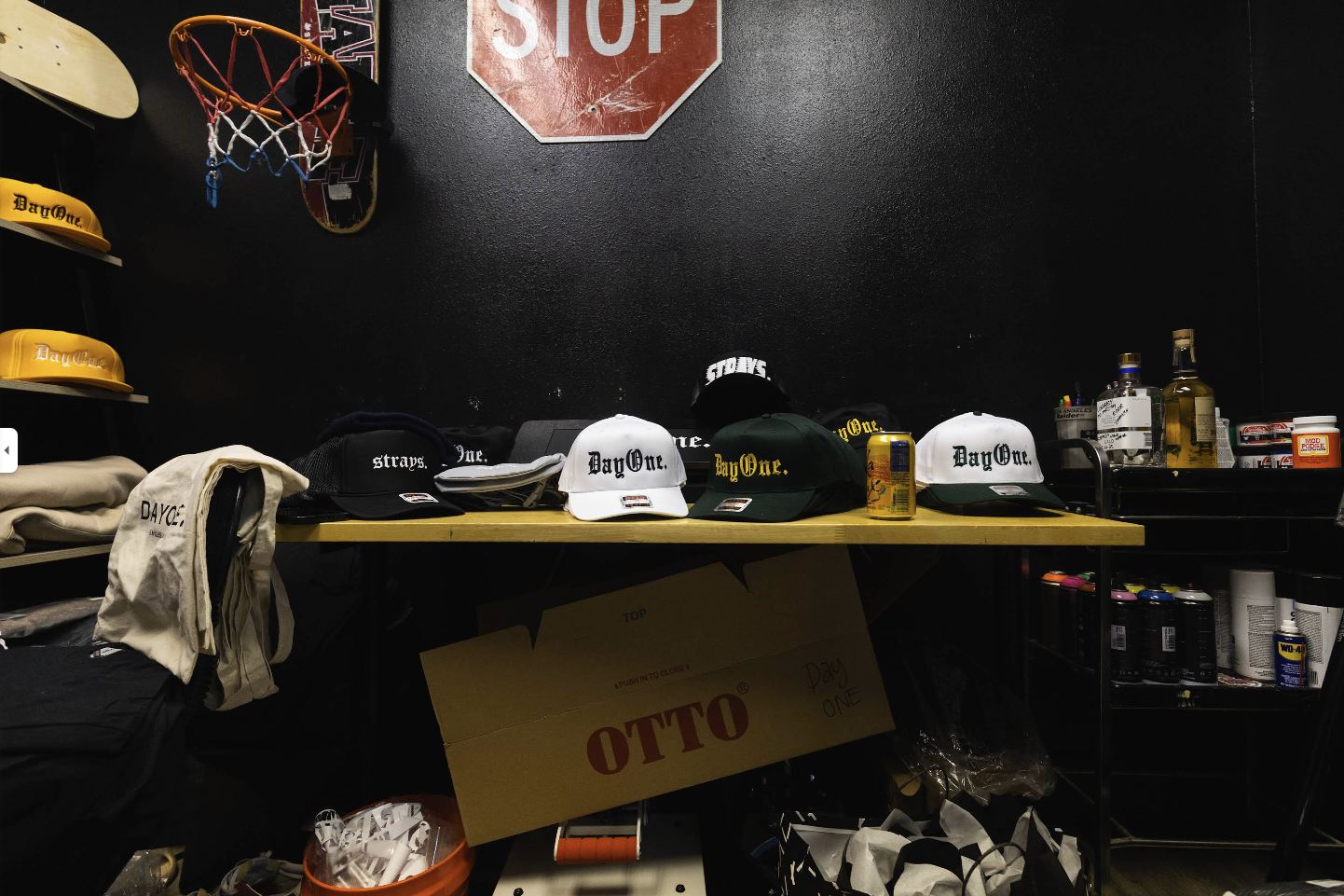 DayOne hats and barber supplies on the shelf at Strays